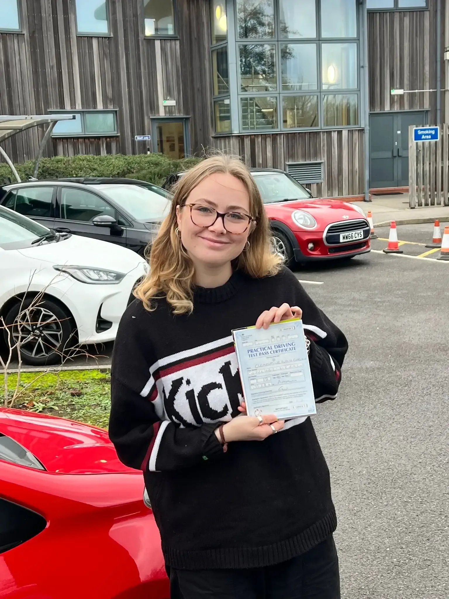 Clem Copeland, holding her practical driving test pass certificate