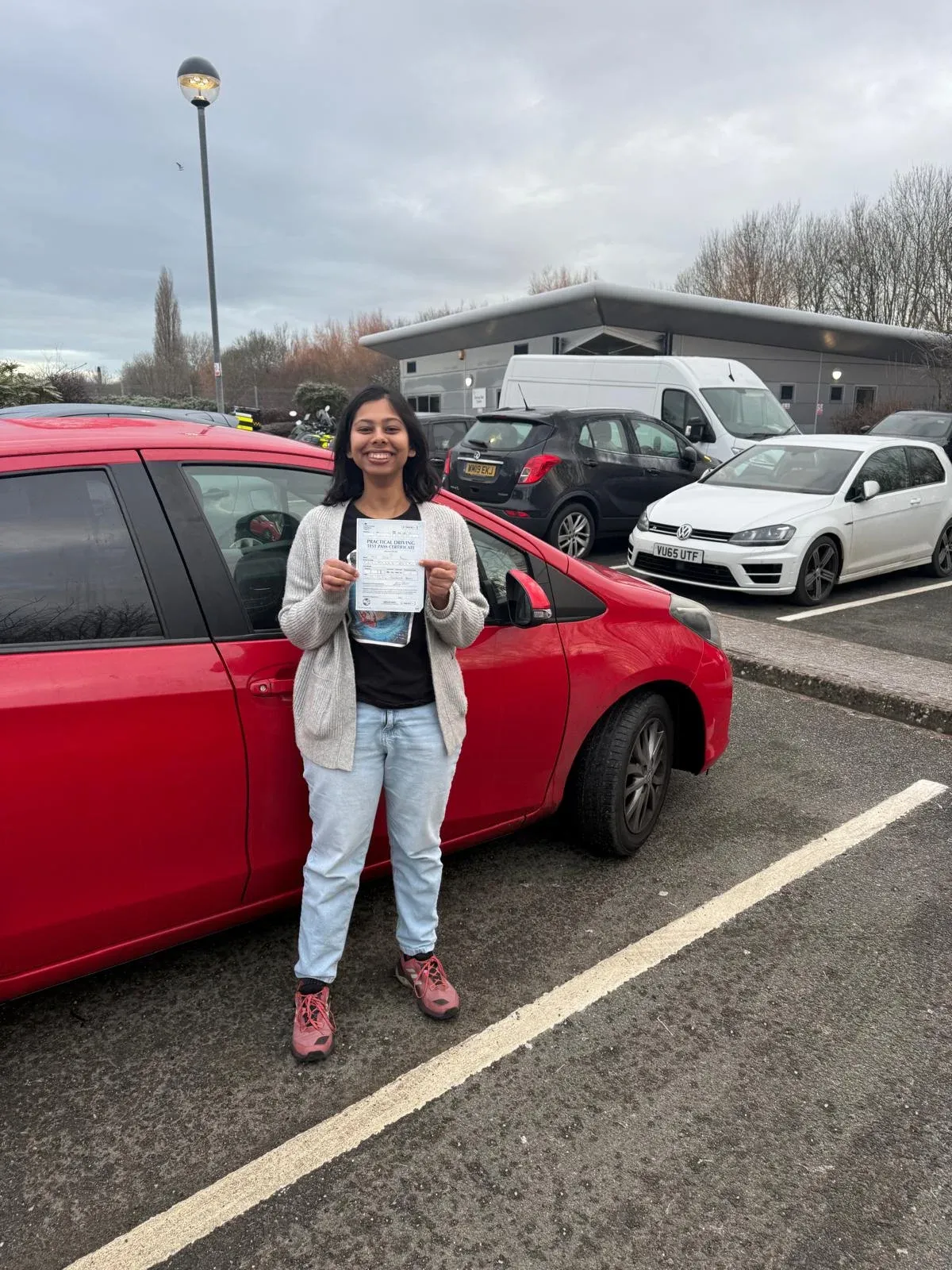 Dhriti Paul, holding her practical driving test pass certificate