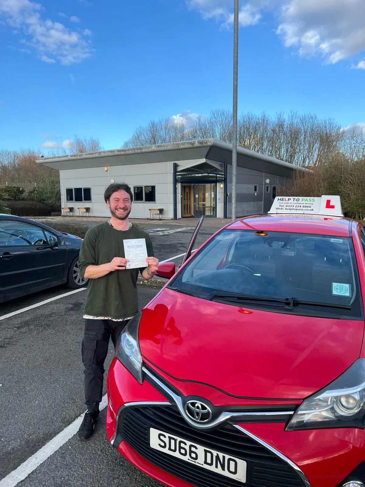 James Parker, holding his practical driving test pass certificate