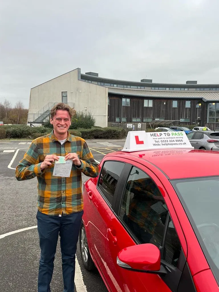 Joseph Lines, holding his practical driving test pass certificate