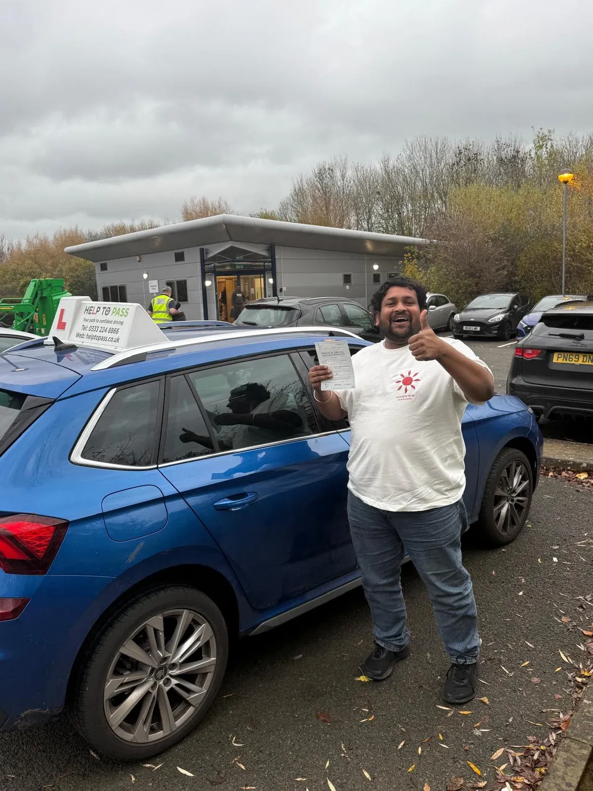 Shashikanthki Bussary, holding his practical driving test pass certificate