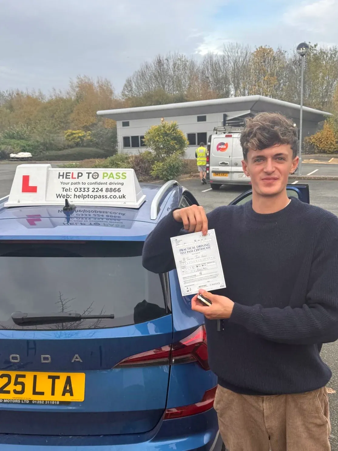 Tom Horner, holding his practical driving test pass certificate